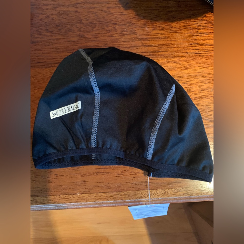 NWT cycling helmet liner. Black thermal. Woman’s OS